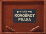 otevřený nákladní vůz červenohnědý s nákladem uhlí „Kovošrot Praha“, typ E/Vtr
